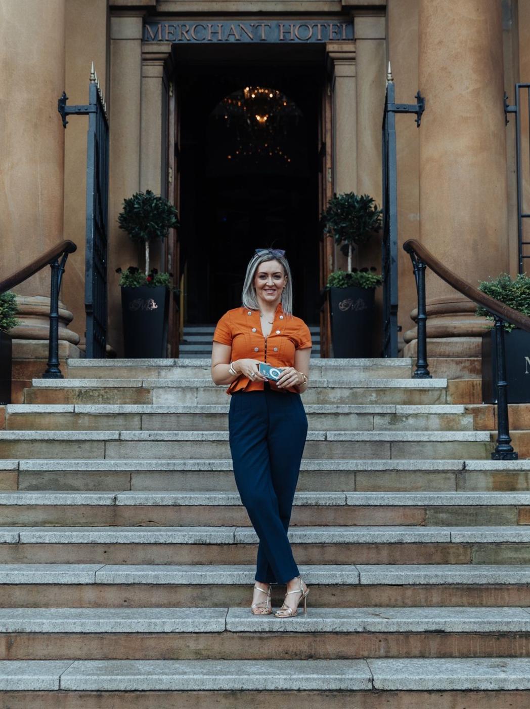 Maria Morgan on the steps of the Merchant Hotel in Belfast